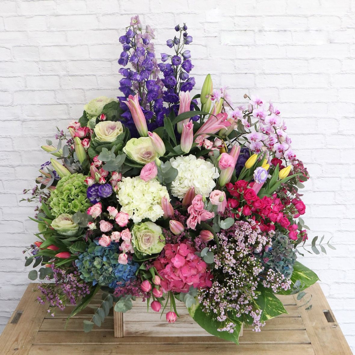 mixed flowers arranged in a box