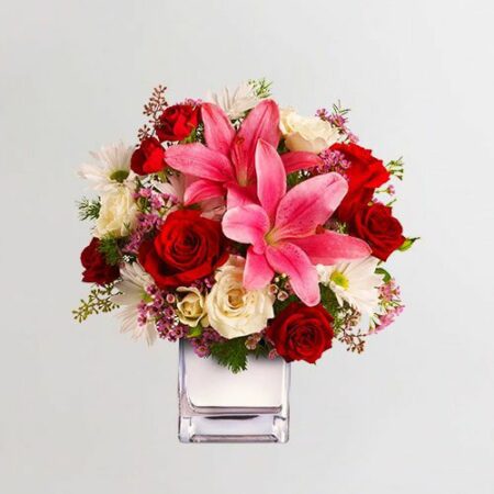 Mix of Red Rose, Peach Rose, Pink Lilly, Chrysanthemum with fillers in a vase