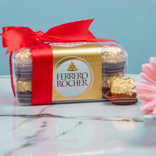 A box of Ferrero Rocher chocolates with a red bow