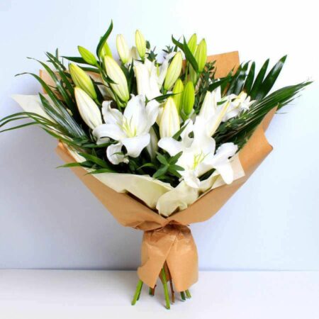 White lilies with fillers in a nice wrapping