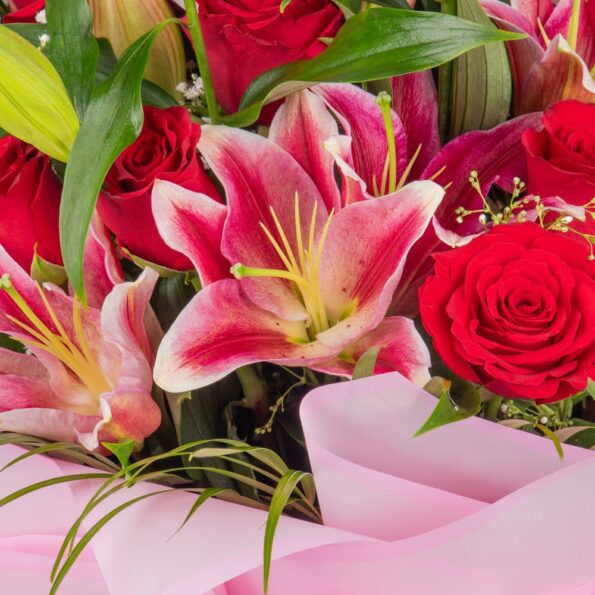 close up of lilies and roses