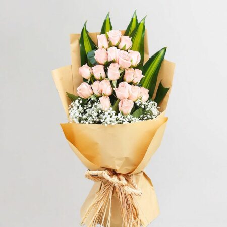 Peach roses with baby's breath in a nice wrapping