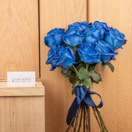 Blue rose bouquet tied with blue ribbon