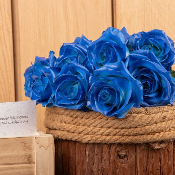 A close up view of blue roses on a table