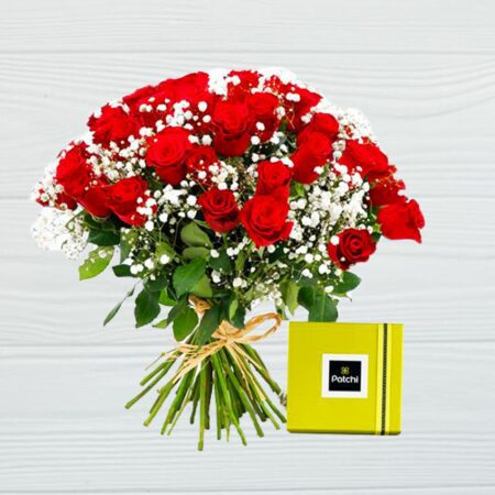 Bouquet of red roses and baby's breath with a yellow box of chocolates