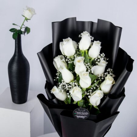 White rose bouquet in a black wrapping