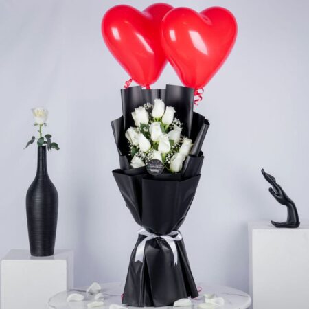 White rose bouquet with two heart shaped red balloons