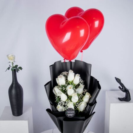White rose bouquet with two heart shaped red balloons