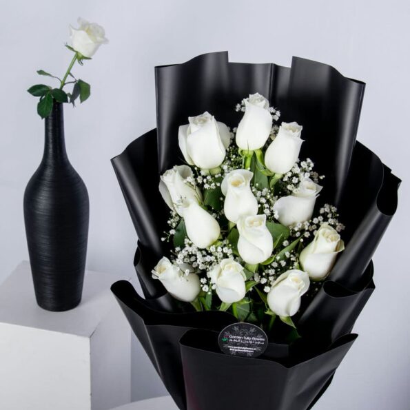 White roses in a black wrapping