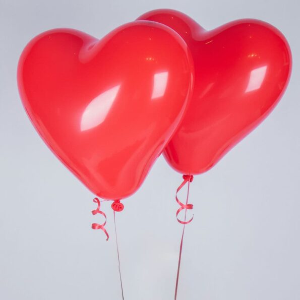 two heart shaped red balloons