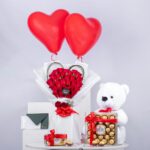 Eternal Beauty Combo – Red Rose Bouquet with Teddy Bear, Chocolates and balloons
