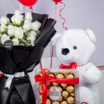 Serene Bliss Combo – White Rose Bouquet with Teddy bear, chocolates and balloons