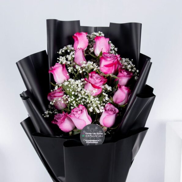 Pink rose bouquet with baby breath's in a black wrapping