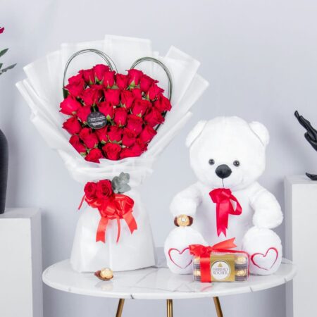 Red Roses arranged in Heart Shape with Chocolates and teddy bear