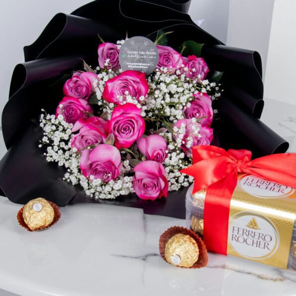 A close up view of pink rose bouquet with chocolates