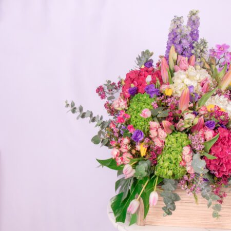 Stunning display of rare and fascinating flowers, meticulously arranged in a handcrafted wooden box.