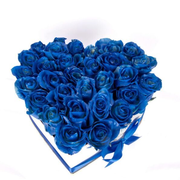 Blue roses arranged in heart shaped white box