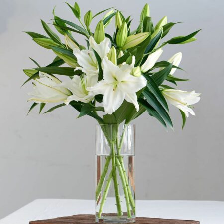White lilies in a glass vase