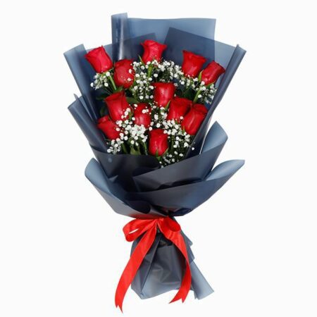 Red roses with baby's breath wrapped in a black paper