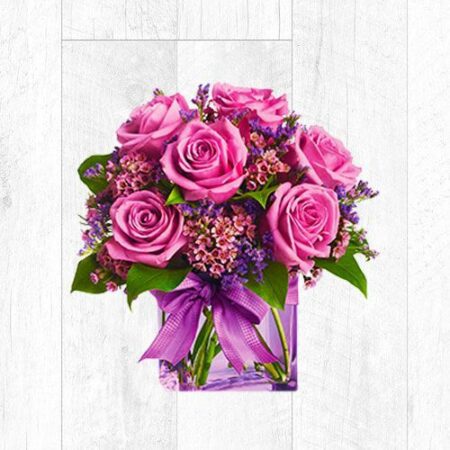Purple roses with fillers in a vase